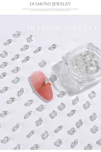Close-up of sparkling horse-eye shaped clear zircons for professional nail art decoration