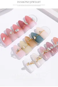 Close-up of elegant nail art accessories featuring super flash zircon and crystal drops