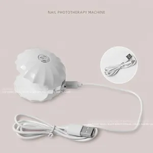 Shell-shaped mini LED nail lamp for gel polish with USB charging cable white
