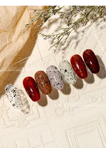 Detailed close-up showing the unique quail eggshell effect on various colored nail tips
