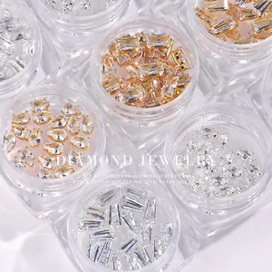 Assorted clear nail art zircons in water drop and horse eye shapes with gold claw settings