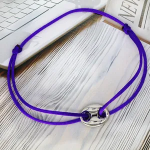 Purple adjustable friendship cord bracelet featuring a silver pig nose charm design