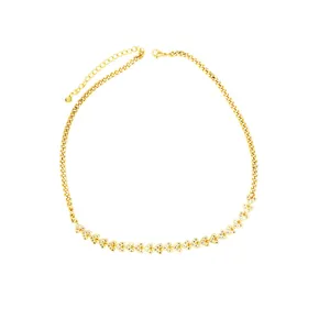 Close-up of gold curb chain necklace with sparkling crystal-encrusted hearts