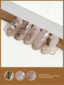 Macro detail view of 3D solid carving gel nail art with chrome and pearl design