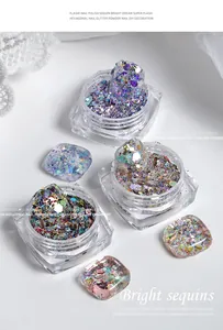 Macro view of bright hexagonal nail glitter and colorful sequins for DIY nail art decoration