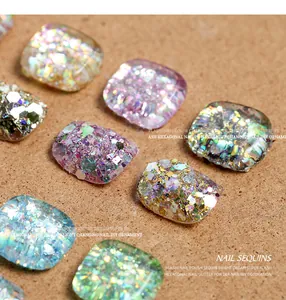 Macro detail of iridescent hexagonal nail sequins for DIY sparkling nail art decoration