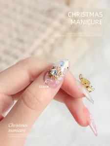 Macro view of luxury golden snowflake nail charm with a sparkling zircon center