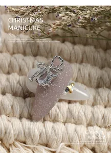 Luxury zircon bow nail art decoration with glittering pink base for Christmas style manicure