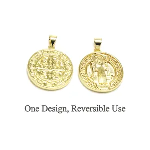 Macro view of a double-sided gold Saint Benedict medal pendant for DIY jewelry making