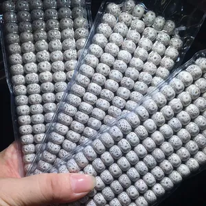Close-up of high-density Hainan Star Moon Bodhi beads in clear plastic packaging