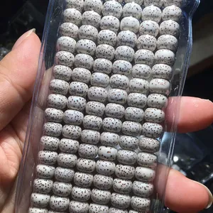 Macro detail of natural white star and moon bodhi seeds with brown patterns.