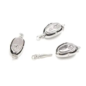 Close-up detail of silver-toned fishhook safety clasps for DIY jewelry making