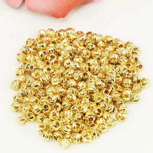 Detailed view of 18k gold-filled 11-cut faceted spacer beads for DIY jewelry