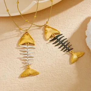 Detail of titanium steel fishbone necklaces with gold, silver and black pendant parts.