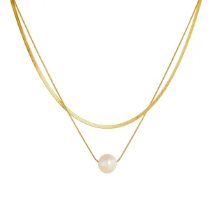 Elegant gold double-layered stainless steel necklace featuring a natural pearl pendant
