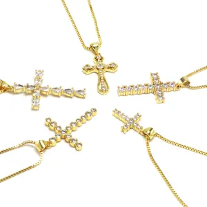 Detailed view of five different gold cross necklaces with sparkling zircon stones for women