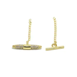 Detail of gold OT toggle clasps for necklaces, featuring one plain and one pavé cubic zirconia bar.