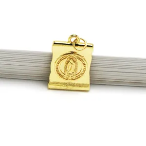 Detailed view of the gold-tone religious Virgin Mary charm for DIY jewelry