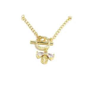Detail showing a gold OT toggle clasp with pave crystals and a bee charm for DIY jewelry