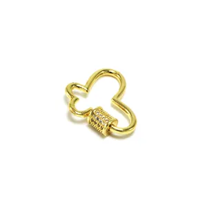 Macro detail view of a gold-plated heart screw clasp with pavé cubic zirconia stones