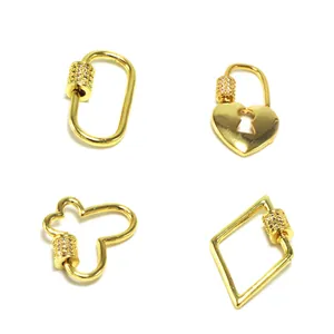 Detail of gold-plated zircon encrusted heart and geometric screw lock clasps