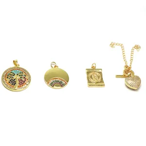 Detail view of four gold jewelry pendants with colorful zircon and micro-pave charms