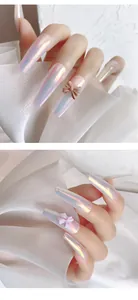 Macro detail of 3D resin bow charms on pearlescent iridescent false nails set