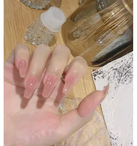 Detailed macro view of long nails with translucent nude pink jelly gel polish finish.