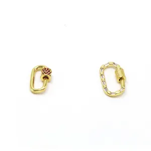 Detail of decorative gold-plated carabiner screw clasps with red and clear stones