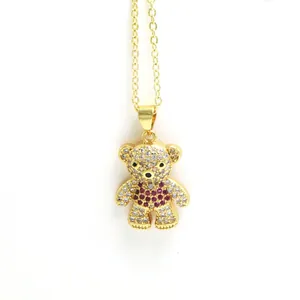 Close-up of sparkling teddy bear pendant with clear and magenta cubic zirconia stones