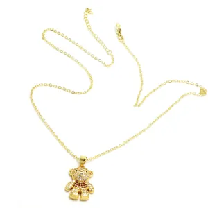 Detailed view of the gold-plated teddy bear pendant necklace with sparkling zircons