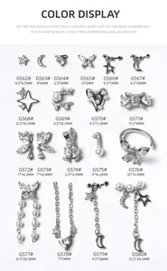 Close-up view of various silver zircon nail jewelry charms with stars and moons.