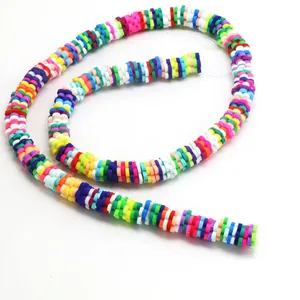 Detailed view of multi-colored polymer clay Heishi disc beads for DIY jewelry making