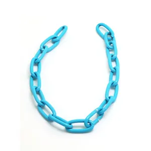 Macro detailed view of bold bright blue chunky geometric chain links for DIY jewelry design
