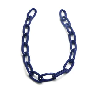 Detailed macro view of dark blue geometric plastic chain links for DIY punk hip-hop jewelry