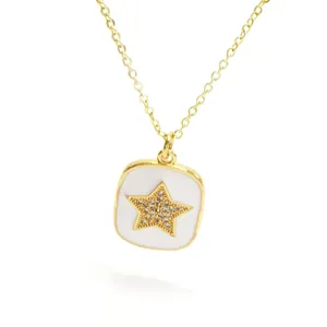 Close-up of a gold star pendant necklace with sparkling stones on a white background