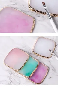 Detail of Japanese resin nail art palette with elegant gold-plated edges
