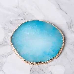 Round blue marble resin nail art palette with gold rim for polish mixing and display