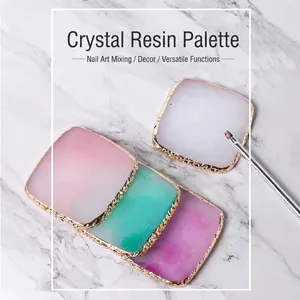 Elegant resin nail art palette featuring gold edges and marble textures in four colors