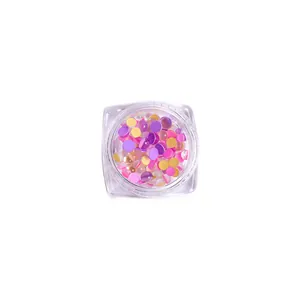 Colorful mixed candy color mermaid aurora round nail art beads in a clear jar, top view shot