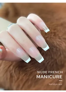 Detailed view of long square nude French manicure nail tips featuring white tips