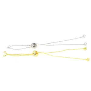 Close-up view of adjustable beaded slider bracelet chains in gold and silver finishes