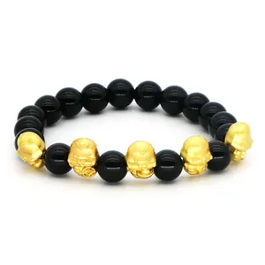 2025 Year of the Snake bracelet with black obsidian beads and golden lucky charms