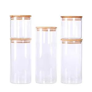 Set of 5 clear glass storage jars with airtight bamboo lids in various heights