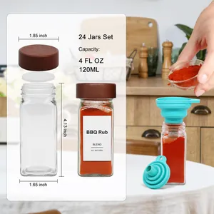 Detail view of 4oz glass spice jars set with acacia wood lids and blue funnels