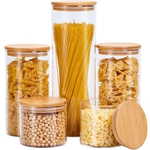 Set of 5 clear glass storage jars with bamboo lids for kitchen organization