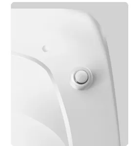 Macro detail of the white LED nail lamp showing button and smooth finish.