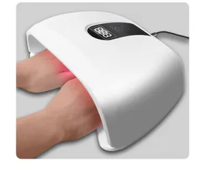 Detailed view of white LED nail dryer lamp with red light curing two hands at once
