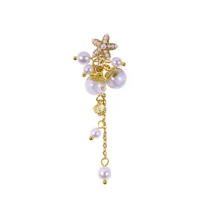Elegant gold starfish pearl pendant charm for nail art with dangling chain detail