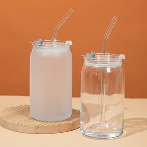 Comparison of frosted and clear glass can cups with straws and lids for cold drinks.